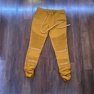 Orange skinny pants.